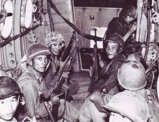 ARVN soldiers inside a CH-21 helicopter wait to be flown to the drop area.