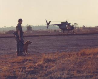 A dog handler with a combat tracker team from the 4th Inf.