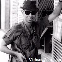 Louis Galanos with his M2 Carbine in front of the classified documents office at the United States Army Support Command in Qui Nhon.