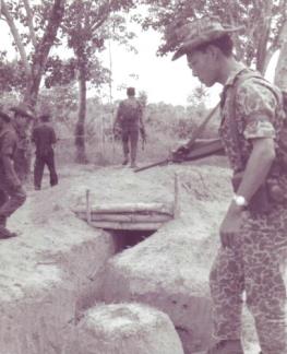 Vietnamese Strike Forces discover a Viet Cong dugout in the Ap Suoi rubber plantation in war zone “D”, north of Ben Cat (III Corps).