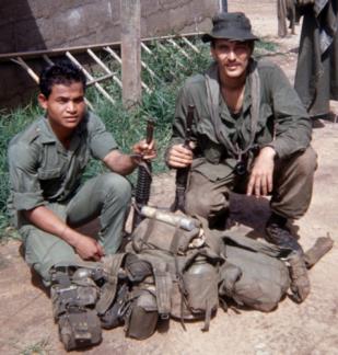 Spike Team Ohio medic Joe Parnar (right) and team grenadier Mock, a Rhade Montagnard, after returning from a mission.