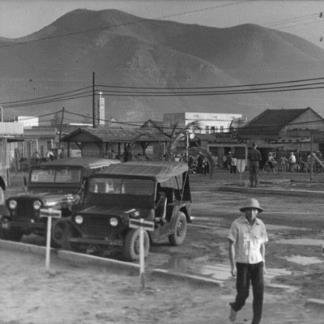 The Qui Nhon headquarters compound as the Vietnamese workers arrive early in the morning for work.