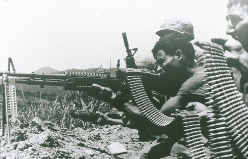 A fire team of the 101st Airborne lays down a base of fire.