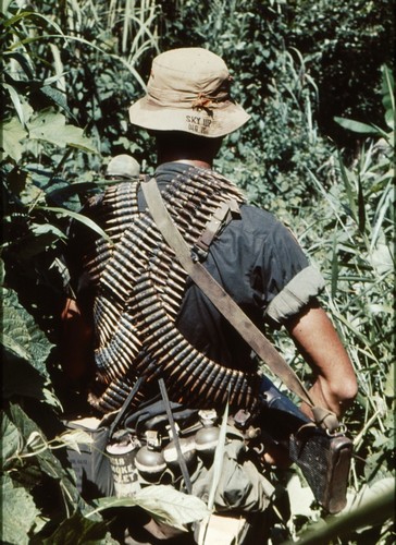 An M60 gunner of the 101st Airborne’s 17th Cavalry carries five belts of ammunition whilst on a reconnaissance patrol near Quang Tri.