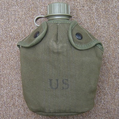 Plastic 1 quart canteen inside the M1956 cover.