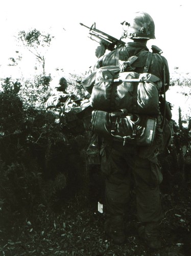A grenadier of the 35th Infantry, 25th Infantry Division uses the M1956 strap assembly to carry his sleeping gear.