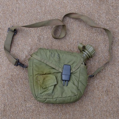 2nd pattern 2 quart corner neck canteen cover with a non-detachable strap.