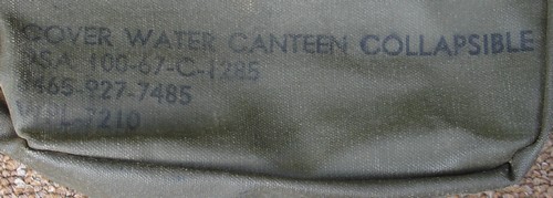 Nomenclature and contract stamp on the back of the 1967 rubberized 2-quart canteen cover.