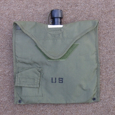 The 2nd pattern 2 quart canteen cover had a Velcro fastener and a pocket for water purification tablets.