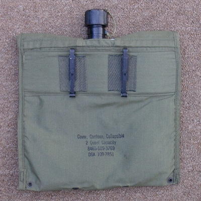 Slide keepers on the back of 2nd pattern cover were used to attach it to the pistol belt.