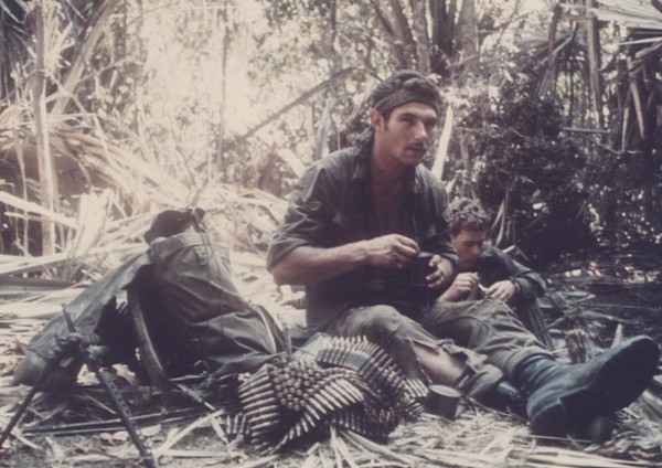 Private Richard Bradley, 'B' Squadron, 3rd Cavalry Regiment, 6 RAR, eats chow after sweeping a bunker complex south of Ap Rung La.