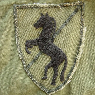 Locally made subdued 11th Armored Cavalry Regiment shoulder sleeve insignia.