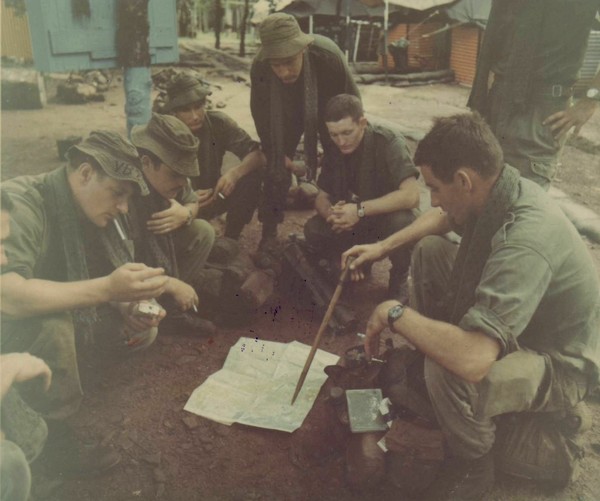 A squad leader from Co ‘B’, 2 RAR, gives a briefing to his men at their camp at Nui Dat.