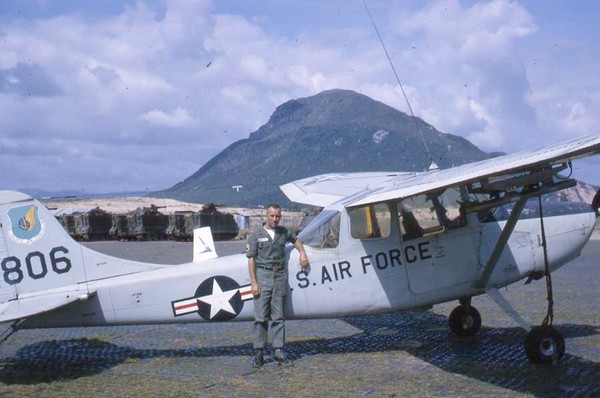 Overlooked by Tuy Hoa’s Chop Chai Mountain, MACV advisor Tim Coughlin stands in front of a U.