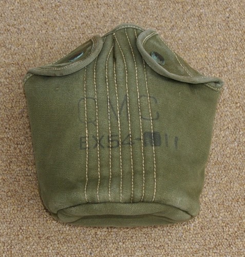 The experimental EX 54-11 Canteen Cover was made from OD7 cotton duck and was closed by two snap fasteners.