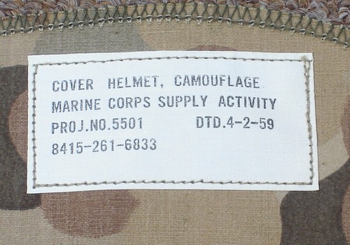 The first contracts for the production of the Mitchell pattern Helmet Cover were issued in 1959 by the Marine Corps Supply Activity.