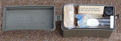 The Plastic Insert contained the components of the Individual First Aid Kit.