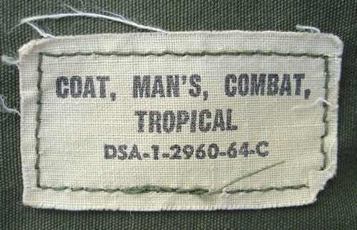 The Tropical Combat Jacket identification label displayed the nomenclature and contract number.