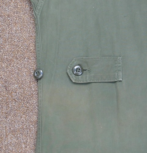 The first and second versions of the Tropical Combat Jacket featured adjustable waist tabs.