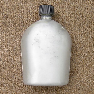 M1910 aluminum canteen with a vertical seam and plastic cap.