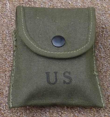 The body of the first pattern M1956 First Aid pouch had no edging and no drain hole.
