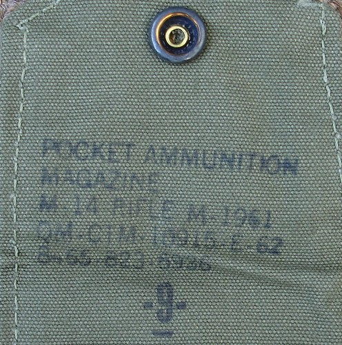Nomenclature stamp inside the flap of a 1962 dated ‘short’ M1961 ammunition pocket.