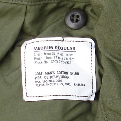 Nomenclature and contract number label from inside the neck of the M1965 Field Coat.