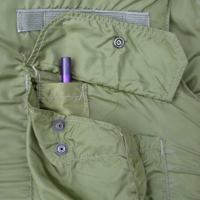 The M69 flak vest's left cargo pocket contained a pen compartment.