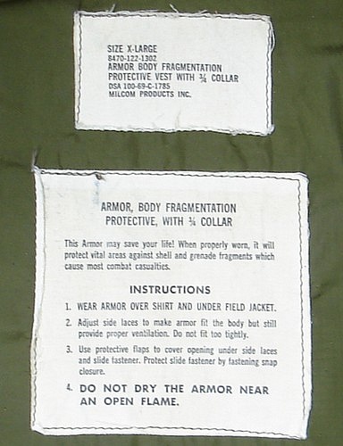 Identification and instruction labels from the 122 series zip closure M69 flak vest.