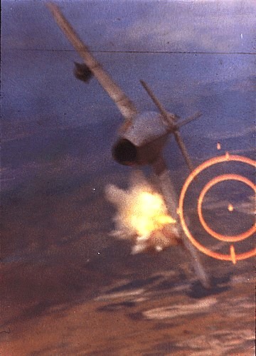 Major Ralph Kuster shoots down a North Vietnamese MiG-17 with his F-105's 20mm cannon.