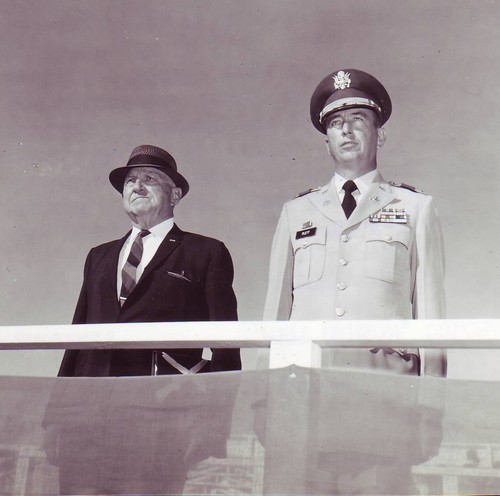 General O'Daniel (left) watches a parade in his honor whilst standing beside Col.