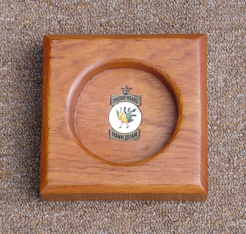 This square wooden ashtray belonged to a U.