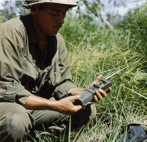 A soldier of the 9th Infantry Division changes the battery of his PRT-4 handheld transmitter.