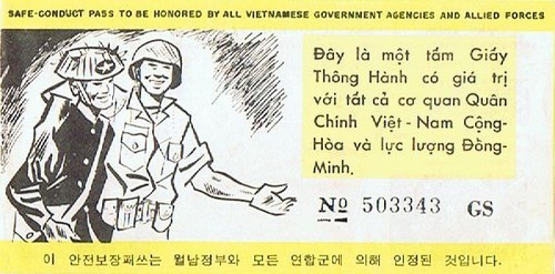 The back of the 5-Flag pass featured a picture of a RVN soldier with his arm around a Viet Cong.