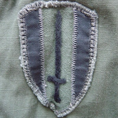 Locally made subdued USARV shoulder sleeve insignia.