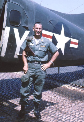 MACV advisor Major Bruce Carswell stands in front of a U.