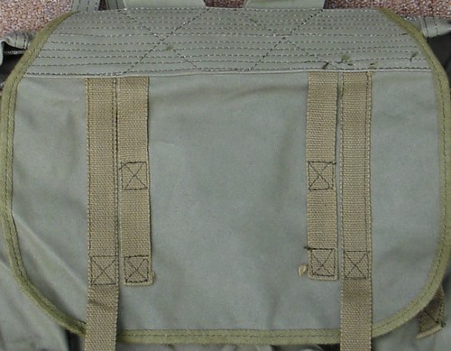 The pack flap of the CIDG Rucksack had four webbing loops on the top.