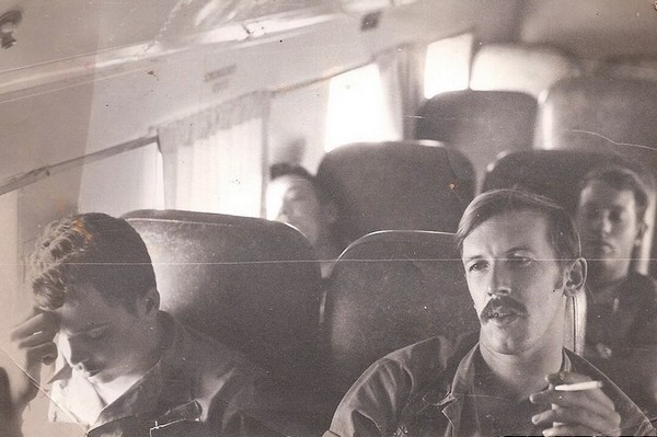 STDAT-158 members Curtis (left) and Ferricks aboard an Air America flight to Saigon.
