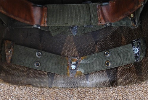 Like the P51 Infantry Helmet Liner, the adjustable neck band was attached to the P55's neck strap via four snap fasteners.