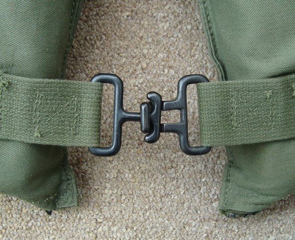 The upper and lower straps on the Work Type Life Preserver were fastened with a black finished brass clasp.