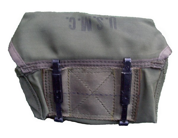 The slide keepers on the back of M-14H pouch were used to attach it to the equipment belt.