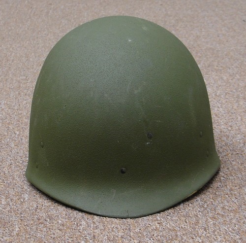 The P64 Parachutist's M1 Helmet Liner was made from laminated high strength nylon fabric.