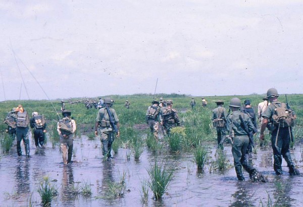 Hong Ngu Regional Forces slog through marshlands whilst on an operation near the Cambodian border in Kien Phong province (IV Corps).