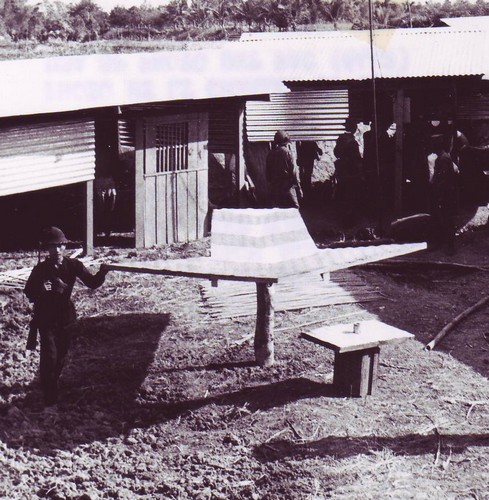 A Self Defense Corps irregular demonstrates the fire direction arrow at outpost Ly Van Manh.