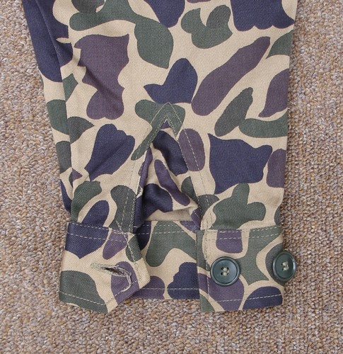 This spot camouflage shirt featured cuffed sleeves with gussets.