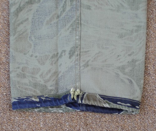 Tadpole Sparse tiger stripe camouflage trousers with leg bottom drawstrings.